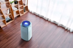 CUCKOO air purifier in a Johor living room, removing dust, allergens, and smoke.